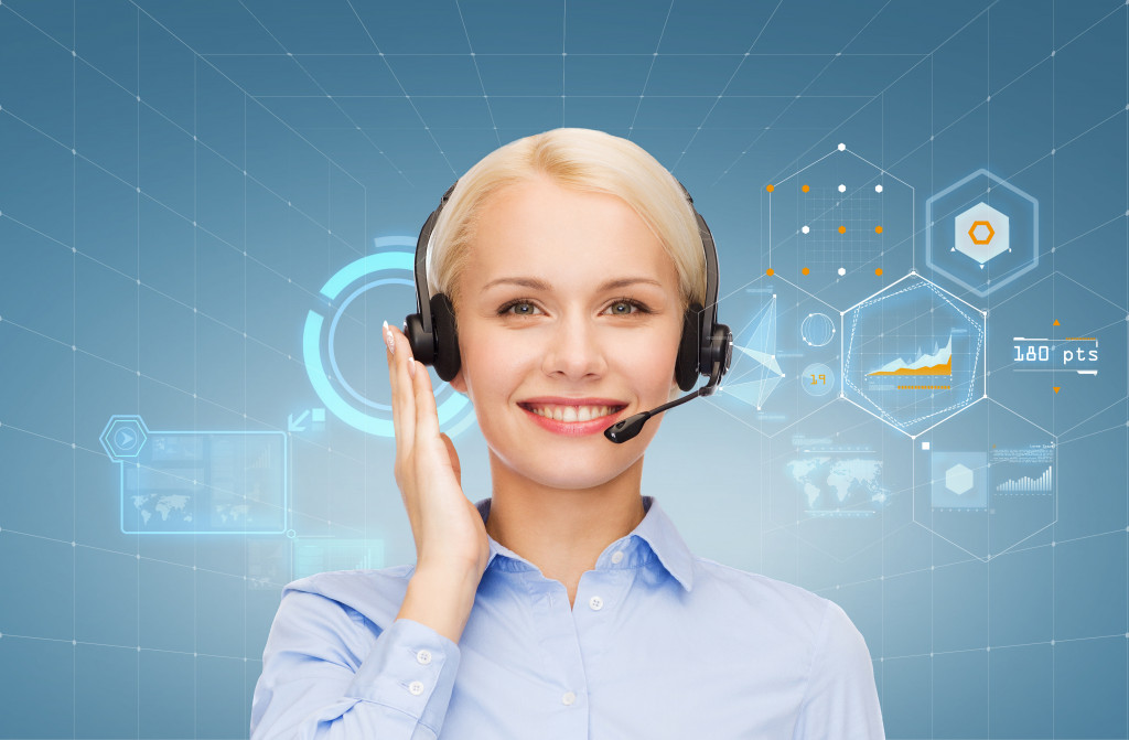 female virtual assistant smiling with tech-related icons 