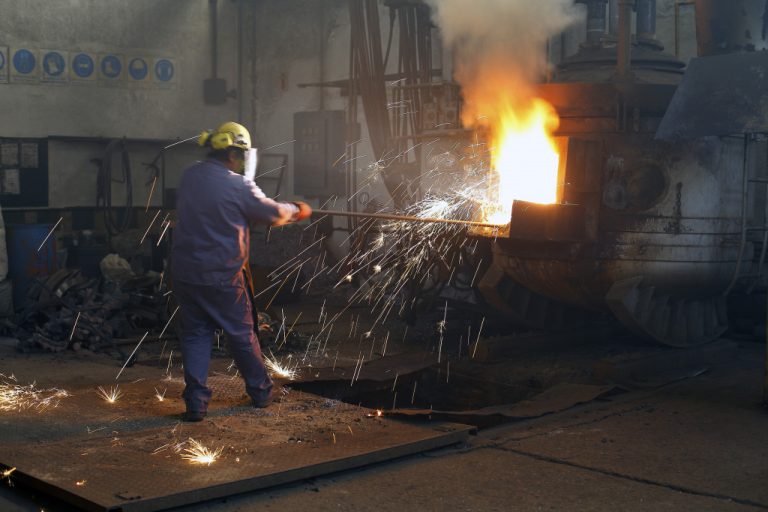 man handling metals in a metallurgical factory