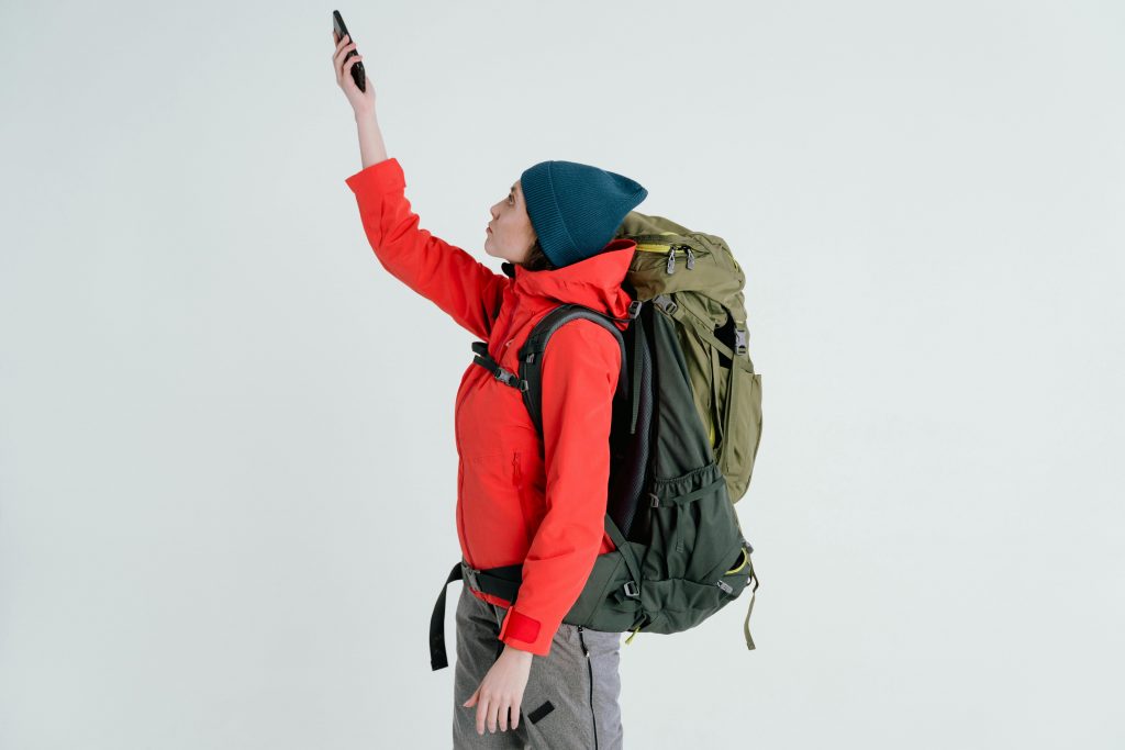 a woman looking for signal with her phone